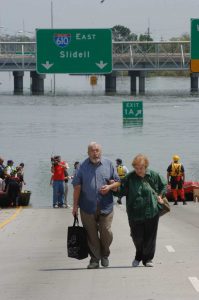 Local residents arrive at the ramp to the Superdome after being rescued from their homes. Photo credit - FEMA