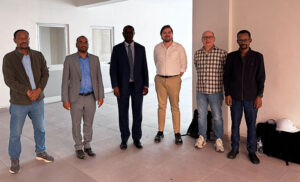 EMI staff, Director General, Max, and Jeff at the new EMI campus.