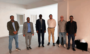 EMI staff, Director General, Max, and Jeff at the new EMI campus.